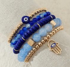 Brand new beaded evil eye pendant bracelet set Beautiful blue and gold beaded bracelets with evil eye pendants Stretch fit 5 pieces Can be worn all together or separated Trendy boho style Smoke-free, dog-friendly environment Fast shipping Bundle deals always welcome! Evil Eye Bracelet Kit, Evil Eye Bracelets Pics, Crystal Beaded Bracelets Evil Eye, Trendy Bracelets Evil Eye, Evil Eue Bracelets, Evil Eye Bracelet Kits, Evil Eye Bracelets Pictures, Evil Eye Bracelet Packaging, Colourful Evil Eye Bracelet