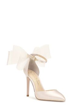 A voluminous bow stands out at the heel counter of an elegant satin pump framed by a pointy toe and stiletto heel. 3 1/2" heel Adjustable ankle strap with buckle closure Textile upper/synthetic lining and sole Imported Fitted Ankle Strap Heels With Bow, Fitted Heels With Satin Bow And Ankle Strap, Formal 4-inch Ankle Tie Heels, Satin Ankle Tie Heels With Wrapped Heel, Elegant Ankle Tie Heels With Wrapped Heel, Fitted High Heel Wedding Shoes With Bow, Wedding Heels With Satin Bow Open Heel, Wedding Heels With Satin Bow And Open Heel, Wedding Heels With Satin Bow