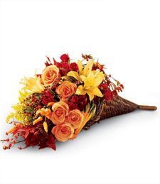 a bouquet of flowers sitting on top of a white surface