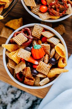 two bowls filled with halloween snack mix