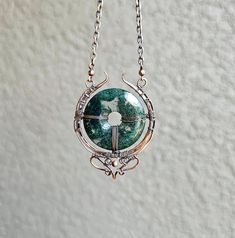 THANK YOU 🦋 for visiting my small shop. I am very grateful for your support. The item in the photo is the one that you will receive. This is a natural Moss Agate with oxidized/patinaed copper for an antique look.  I try my best to take photos that depict the item as it appears in person.  🦋 It is very important to me that you have an excellent experience with my shop. If you have any concerns, please don't hesitate to get in touch with me. The reviews are very important and valued. Please take Spiritual Silver Crystal Necklace With Copper, Spiritual Round Wire Wrapped Necklace, Handmade Spiritual Moss Agate Necklace, Handmade Copper Crystal Round Pendant Necklace, Handmade Crystal Round Pendant Necklace For Healing, Unique Hand Wrapped Moss Agate Necklace, Silver Crystal Necklaces Perfect For Gifts, Agate Round Pendant Crystal Necklace For Healing, Agate Round Pendant Necklace For Healing