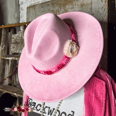 Pretty in Pink Fedora Hat Add a touch of boho-chic to any outfit with our Pretty in Pink Fedora Hat. Featuring a gorgeous floral strap and unique design, this hat is the perfect addition to your country casual or concert season looks. One size fits all. (You'll be turning heads, trust us!) Pink Fedora Hat, Pink Fedora, Dragon Heart, Country Casual, Trendy Boutique, Boutique Fashion, Trendy Clothing, Statement Necklaces, Country Girl