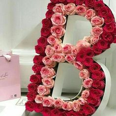 the letter b is made out of pink roses