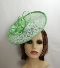 Hatinator/Fascinator in Apple green sinamay. I have hand sculptured this fascinator/hatinator and overlayed the brim with mint green lace, it is trimmed with sinamay loops. It is secured with a fine covered headband which can easily be hidden by your hair if desired. One size fits all Elegant Green Fascinator For Church, Green Headpiece For Church And Royal Ascot, Adjustable Green Mini Hat For Wedding, Elegant Green Church Fascinator, Green Hat Fascinator For Wedding, Green Evening Fascinator Hat, Adjustable Green Costume Hats And Headpieces For Wedding, Green Curved Brim Costume Hat For Wedding, Green Mini Hat With Curved Brim For Wedding