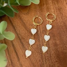 🤎 Item details 🤎 Size: Hoop 12x2mm    Total length 5cm Material: White Mother of Pearl High quality 18k gold plated hoop earrings White Heart Beads Drop Earrings, White Drop Earrings With Heart Beads, White Dangle Heart Earrings With Ear Wire, White Dainty Earrings With Heart Charm, Minimalist Dangle Hoop Earrings For Valentine's Day, White Dainty Gold-plated Hoop Earrings, Trendy White Double Heart Jewelry, White Gold Plated Dainty Hoop Earrings, White Dangle Heart Bead Earrings