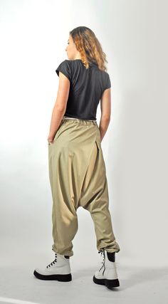 "Harem Pants, Wide Leg Pants, Beige Pants Beige loose soft wool pants,casual extravagant pants. Woman Harem pants. Very comfortable asymmetric loose pants. This pants is very convenient for your daily life. All my clothes are unique and boutique. Each model was conceived and comply with fabric and color according to the season and the fashion line. Model size: SIZE S (US 6, UK 10, Italian 40, French 38, German 36, Japan 7) bust: fits bust around 35.5\" / 90cm Waist: fits waist around 28\"/ 71cm Baggy Wide Leg Khaki Pants, Wide Leg Khaki Harem Pants With Pockets, Khaki Wide Leg Harem Pants With Pockets, Loosely Fitted Khaki Harem Pants With Pockets, Loosely Fitted Hips Khaki Cargo Pants, Khaki Wide Leg Harem Pants With Loose Fit, Khaki Harem Pants With Side Pockets, Khaki Harem Pants With Loosely Fitted Hips, Stretch Khaki Cargo Pants