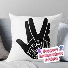 a black and white pillow with the words support independent artists on it