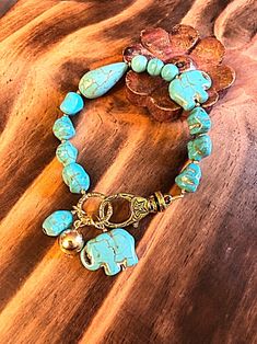 Excited to share this item from my #etsy shop: Turquoise bracelet with turquoise elephant ,gypsyjewelry , hippy jewelry, bohochic, bohemian style Turquoise Hippie Bracelets As Gift, Turquoise Bohemian Crystal Bracelet With Colorful Beads, Bohemian Turquoise Collectible Bracelets, Hippie Turquoise Hand-strung Bracelets, Bohemian Turquoise Hand-strung Bracelets, Bead Charms Diy, Hippie Jewelry, Evil Eye Charm, Sea Glass Jewelry