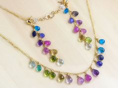 A bevy of luscious semi precious gemstones are combined in this colorful, rainbow drop Necklace. Here I have wire-wrapped the best quality gemstone drops in a rainbow palette of sea foam blue, green, violet and pink, purple and blues. Each drop sparkles like crazy and is very very clear! The design is very modern and [...] Sapphire Jewelry Set, Sea Foam Blue, Fine Jewelry Design, Cloud Earrings, Multi Gemstone Necklace, Blue Gemstone Earrings, Rainbow Palette, Rainbow Gemstones, Rainbow Jewelry