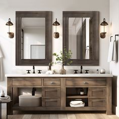 a bathroom with two sinks and mirrors on the wall next to a wooden flooring