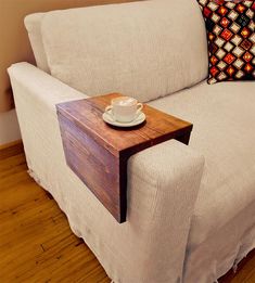 a white couch with a wooden table on it