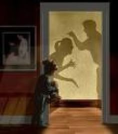 the shadow of a man and woman in front of a door