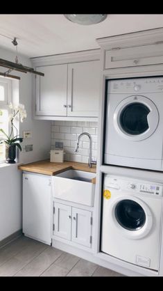 a washer and dryer in a small kitchen