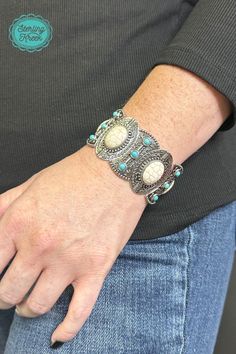 This one-of-a-kind silver bracelet is a real gem! Featuring unique turquoise and white stones, it's sure to add a sparkle to any outfit. So slip it on and show the world your fashionable flair!  width: 1.25  Dont forget to add the matching necklace and earrings! (sold separately) Southwestern Style Metal Jewelry As Gift, Adjustable Sterling Silver Jewelry With Large Stone, White Nickel-free Metal Jewelry, Southwestern Adjustable Jewelry With Stones, Southwestern Silver Bracelets With Natural Stones, Turquoise Metal Bracelet Jewelry, Trendy Turquoise Bangle Jewelry, Trendy Silver Jewelry With Gemstones, Trendy Silver Gemstone Jewelry