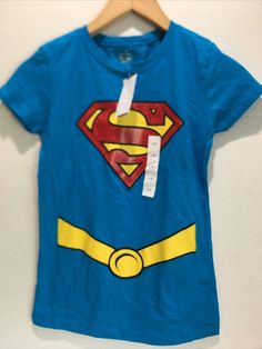 a blue t - shirt with a yellow belt around the waist and a superman logo on it