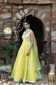 Featuring here Yellow, blue tie dye anarkali Set with mirror, bead,cutdana zari work paired with net choker dupatta. Fabric - Silk and net Components - 2 Colour - Yellow - blue Tie Dye Embroidery details - Hand Embroidery Delivery time - 2-3 weeks Washing Instructions - Dry-clean Chanderi Lehenga With Mirror Work In Maxi Length, Maxi Length Chanderi Churidar With Dupatta, Floor-length Dresses With Gota Work For Transitional Season, Maxi Length Salwar Kameez With Gota Work In Chanderi, Maxi Length Chanderi Salwar Kameez With Gota Work, Anarkali Choli With Sheer Dupatta In Chanderi, Anarkali Floor-length Kundan Dupatta, Floor-length Gown With Gota Work For Eid, Yellow Designer Wear Maxi Churidar