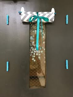 the door is decorated with blue ribbons and bows