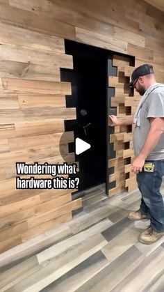 a man standing in front of a wooden wall that has been made out of wood planks