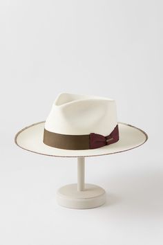 Light and airy, our Monty shantung straw fedora is crafted in the United States to help you keep your cool under the scorching sun. Monty is fully equipped to shield you from intense rays, and its generous brim with whipstitch accents, grosgrain ribbon and bow hatband, and impressive teardrop crown uphold the longstanding tradition of fine hat making. Scorching Sun, Straw Fedora Hat, Straw Fedora, Hat Band, Fedora Hat, Keep Your Cool, Hat Making, Grosgrain Ribbon, Fedora