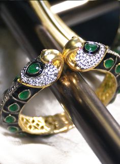 Haritah - Cuff Bracelet with Green Onyx & CZ stones Stone Setting: Onyx & CZ stones Finish: Gold Plated Composition: Metal Alloy Statement cuff bracelet adorned with beautiful green Onyx teardrop gemstones. Furthermore, this statement women's cuff bracelet has a gold plated swan structure accented with minimal CZ stones and ruby eye detail. Green Onyx women's cuff bracelet is adorned with CZ stones at the top end of this statement alloy cuff. *Please chat with us for customization reques Bangle With Stone, Bracelet With Stone, Fremont California, California Bay Area, Eye Detail, Statement Cuff Bracelet, Womens Cuff Bracelets, Eye Details, Gold Plated Bangles