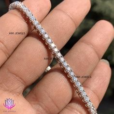 ⭐️ About Product : → Average Length : 7.00 Inch → Average Link: 56 → Closer : Box Clamp With Hinged Safety Lock → Chain Style : Tennis → Setting : Prong ( 4-prong ) ⭐️ Diamonds Details: → Diamonds Carat : 5.00 CTW → Diamonds No : 56 → Diamonds Color : G/H → Diamonds Clarity : VVS → Diamonds Cut : EXCELLENT  → Diamonds Shape : Round  → Diamonds Type : Lab Grown / Moissanite → All detail mentioned for 7.00 inch, its may vary by length. ⭐️ Customization: → Customization available on request. Message us for any customization request. (Metal Purity, Size, Length, Diamond, Etc.) → If you don't find a perfect Jewelry in the store, just message us with the inspiration image and get a free quote and customization in easy steps → We send CAD ( mockup ) for approval before making the jewelry → Free E White Diamond Tennis Bracelet For Anniversary, White Diamond Bracelet With Accents, White Diamond Bracelet With Single Cut Diamonds, Anniversary Diamond Bracelet With Prong Setting, White Moissanite Bracelet Fine Jewelry, White Moissanite Bracelets Fine Jewelry, Classic Moissanite Diamond Bracelet As Gift, White Round Diamond Tennis Bracelet, White Diamond Round Tennis Bracelet