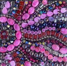 an art work made out of many different colored beads