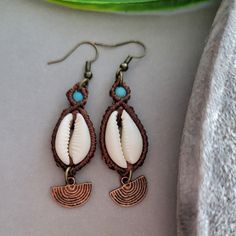 a pair of earrings sitting on top of a table