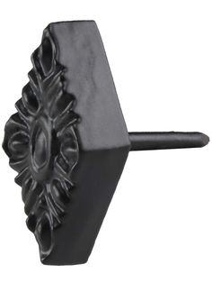 a black door handle with an ornate design on it's face and center piece