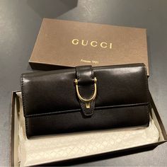 Gucci Wallet. Never Used. Button Clasp. Plenty Of Card Space. And Multiple Bill Compartments. Authentication Card Included. Elegant Wallets With Gold-tone Hardware For Gift, Elegant Bifold Wallet With Gold-tone Hardware, Designer Formal Wallets With Gold-tone Hardware, Elegant Bifold Wallet For Office, Gucci Bifold Wallet For Formal Occasions, Designer Gucci Wallets For Business, Gucci Designer Wallet For Formal Occasions, Elegant Gucci Wallet For Formal Occasions, Gucci Wallets With Gold-tone Hardware For Formal Use