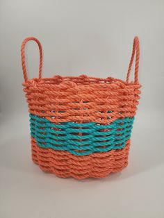 Coral Orange and Teal Lobster Rope Storage basket Rope Storage Basket, Rope Storage, Maine Lobster, Basket Woven, Handmade Baskets, Coral Orange, Wicker Laundry Basket, Storage Basket, The Coast