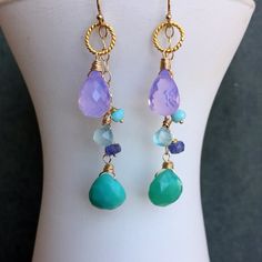 There are just one of these available as I only have one of the jadeite green chalcedony in stock. There are coordinating earrings available but this listing is JUST for the necklace. Faceted lavender pear cut scorolite, chalcedony, tanzanite and peruvian opal are used to create this pretty and vibrant look. The metals used are 24k gold vermeil for the hoop and 14k gold filled for the chain and clasp. Please choose your length preference. Your jewelry will arrive beautifully giftboxed. Elegant Faceted Chrysoprase Jewelry, Chrysoprase Gemstone Drop Earrings, Chalcedony Natural Stone Drop Earrings, Handmade Chrysoprase Dangle Jewelry, Chalcedony Drop Earrings With Natural Stones, Teardrop Chrysoprase Gemstone Jewelry, Chrysoprase Gemstone Dangle Jewelry, Chalcedony Dangle Earrings With Natural Stones, Handmade Teardrop Chalcedony Jewelry