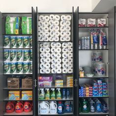 two shelves filled with different types of toilet paper