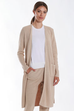 Crafted from a luxurious blend of cotton and cashmere, this cardigan exudes a soft and gentle feel against the skin. The belted design adds a chic and sophisticated touch, making it a versatile piece for any occasion. Whether you're dressing up for a special event or simply looking for a stylish layer to elevate your everyday look, this cardigan is the perfect choice. Elegant Fitted Sweater Coat For Daywear, Elegant Sweater Coat For Spring Loungewear, Elegant Spring Sweater Coat For Loungewear, Elegant Spring Cardigan For Loungewear, Elegant Fitted Sweater For Loungewear, Elegant Cream Sweater For Loungewear, Elegant Beige Sweater Coat For Loungewear, Elegant Long Sleeve Sweater Coat For Daywear, Beige Cashmere Outerwear For Daywear