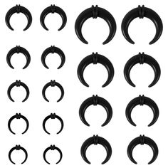 twelve pairs of black horseshoes with different shapes and sizes, all on white background