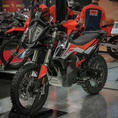 several motorcycles are on display in a showroom