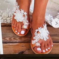 Gorgeous White Lace Flower Flip Flop Sandals Elegant Flat Heel Sandals For Beach Season, White Flat Heel Sandals For Beach Season, Spring Beach T-strap Sandals With Round Toe, White Closed Toe T-strap Sandals For Beach, White Closed Toe T-strap Sandals For Vacation, Elegant Flat Sandals For Beach Season, White T-strap Sandals For Beach Season, White T-strap Sandals For Spring Party, White Flat T-strap Sandals For Spring