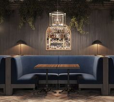 a restaurant with blue booths and wooden tables