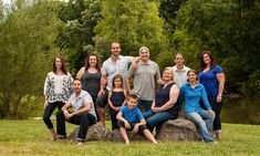 a group of people posing for a family photo