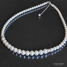 Wedding White Pearl Silver One Row Classic Bridal Statement Necklace. PLEASE READ ITEM DESCRIPTION and SHOP POLICIES before placing your order, and contact me with any questions! NECKLACE is about 18.50 inches (47cm) long. BRIDAL EARRINGS SECTION:https://www.etsy.com/shop/LanaChayka?ref=seller-platform-mcnav&section_id=11638940 BRIDAL BRACELETS SECTION: https://www.etsy.com/shop/LanaChayka?ref=seller-platform-mcnav&section_id=11638942 BRIDAL NECKLACES SECTION: https://www.etsy.com/shop/LanaChayka?ref=seller-platform-mcnav§ion_id=11638944 BRIDAL JEWELRY SETS SECTION: https://www.etsy.com/shop/LanaChayka?ref=seller-platform-mcnav§ion_id=25839214 Elegant and timeless, this beautiful necklace is perfect for weddings or special occasions such as birthdays, anniversaries, graduations, proms...or Elegant Single Strand Bridal Necklace For Wedding, Classic Pearl Chain Jewelry For Weddings, Single Strand Pearl Necklace For Wedding, Pearl Bridal Necklace For Wedding, Elegant Single Strand Necklace For Wedding, Round Pearl Embellished Jewelry For Wedding, Classic Silver Necklace For Mother Of The Bride, Classic White Jewelry For Wedding, Classic White Wedding Jewelry