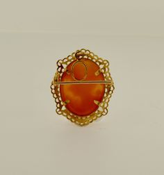 18K yellow gold oval shell cameo brooch/pendant with a filagree frame Dimensions: 1 x 0.875 inches Ornate Oval Intaglio Brooches, Gold Oval Cameo Brooch, Classic Oval Cameo Brooch, Victorian Oval Filigree Brooches, Heirloom Filigree Oval Brooch, Heirloom Style Oval Filigree Brooch, Heirloom Oval Filigree Brooch, Yellow Gold Oval Cameo Brooch, Yellow Gold Brooch With Oval Cabochon