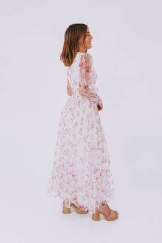 Get ready to turn heads with the Romance In The Air Dress! This off-white dress boasts a stunning floral print and a flattering V neckline. The smocking around the waist and sleeve cuffs creates a perfect fit, while the long sheer sleeves add an elegant touch. With a maxi length and a tier on the skirt, this dress is sure to make you feel like a romantic dream! Details Off white dress with floral print V neckline Smocking around waist and sleeve cuffs Fully lined Long, sheer sleeves Maxi length Nursing Friendly Tops, Nursing Friendly Dress, Plus Jumpsuit, Off White Dresses, Tank Top Long Sleeve, Exclusive Dress, Basic Dress, Maternity Shops, Women Set