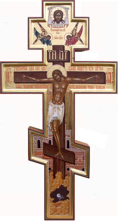 the crucifix is painted in gold and red with an image of jesus on it