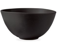 a black bowl sitting on top of a white table