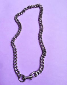 My take on Stevo's iconic necklace from SLC Punk. Crafted in iron chain with a statement lobster clasp just like the ones that make up Stevo's necklace. DIMENSIONS: Neck girth 20.5in Trendy Metal Necklace With Lobster Clasp, Edgy Choker Necklace With Lobster Clasp, Metal Link Choker With Chunky Chain, Grunge Metal Chain Necklace For Gift, Grunge Style Metal Chain Necklace For Gift, Silver Chain Choker In Grunge Style, Punk Chain Link Necklace, Punk Style Chain Link Necklace, Metal Chain Link Choker With Lobster Clasp