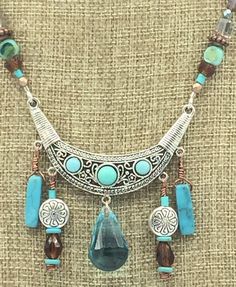 "Boho Turquoise Natural Stone Jewelry Set. Necklace and Earrings. Sw. Austrian Crystal Large Turquoise Drop on Necklace Focal. Earrings with Beaded Tassels. Magnetic Rhinestone Clasp. Jesse James Beads * Sw. Austrian Crystal Large focal drop *Turquoise  *Boho *Rhinestone Magnetic Clasp  *Necklace 18\" *Beaded Tassels *Turquoise Natural Stone *Necklace $45.00 *Earrings $15.50" Turquoise Costume Jewelry With Dangling Beads, Turquoise Dangling Beads Costume Jewelry, Bohemian Turquoise Jewelry With Dangling Beads, Bohemian Turquoise Dangle Jewelry, Turquoise Dangle Costume Jewelry Necklace, Turquoise Dangle Costume Jewelry Necklaces, Bohemian Turquoise Jewelry Sets For Gifts, Turquoise Dangle Necklace Costume Jewelry, Bohemian Green Turquoise Dangle Necklace