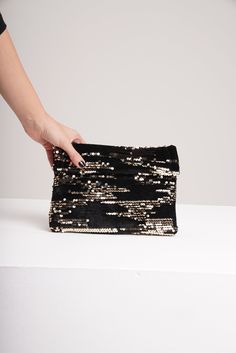 Your style will shine brightly with the fabulous design of this sequin bag. Embellished with shimmering flake, this clutch is the perfect finishing touch on any refined ensemble. This bling evening purse is ideal for any cocktail party or even your big wedding day. Glamorous Sequined Bags For Events, Glamorous Sequined Shoulder Bag For Night Out, Glamorous Event Bags With Sequins, Glamorous Sequined Event Bag, Chic Sequined Clutch Bag, Glitter Clutch Evening Bag, Chic Evening Clutch With Glitter, Rectangular Shoulder Bag With Sequins For Night Out, Rectangular Sequin Shoulder Bag For Night Out