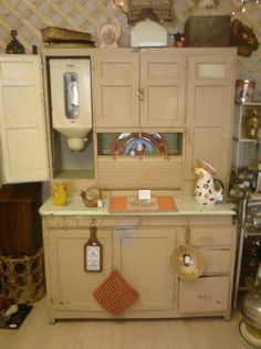 an old fashioned kitchen with lots of cupboards