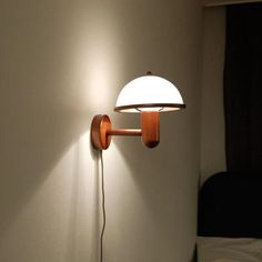 a lamp that is on the side of a wall