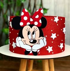 a red minnie mouse cake with white stars on it