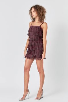 This Embellished Faux Suede Fringe Mini Dress is perfect for a night out on the town. With its sleeveless design, fringed detail, and embellished accents, this dress is sure to turn heads. Whether you're hitting up a club or going to a fancy dinner, this mini dress is a great choice. You'll look and feel fabulous in this amazing dress. Faux suede Adjustable straps Fringe detail torso Mini length Sleeveless Lined Hand wash cold Do not bleach Do not tumble dry Do not dry clean Do not iron Shell: 5 Party Mini Dress With Fringe, Knee-length, Knee-length Fringe Mini Dress For Party, Cocktail V-neck Mini Dress With Fringe, Cocktail Mini Dress With Fringe And V-neck, Party Mini Dress With Fringe And V-neck, Suede Mini Dress, Fringe Mini Dress, Rhinestone Dress, Suede Fringe